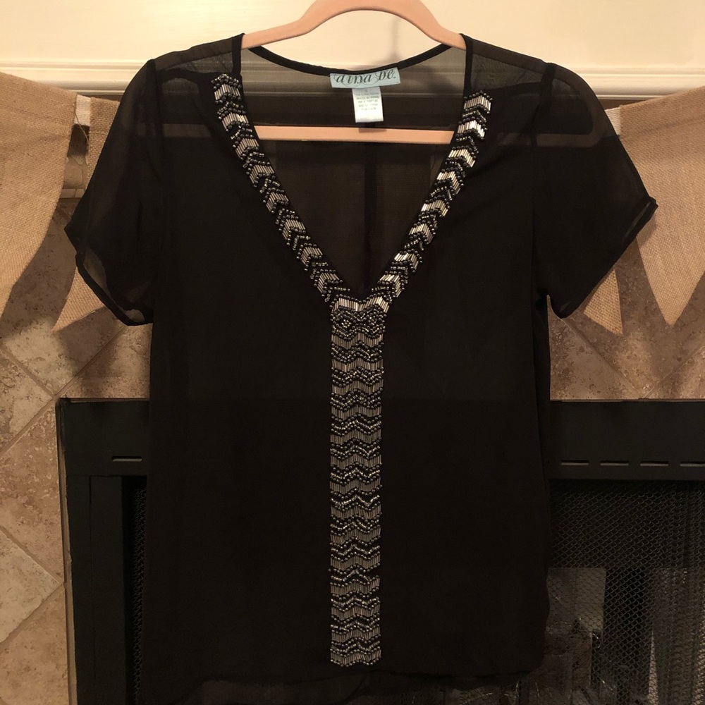 Black boutique top with silver beadwork